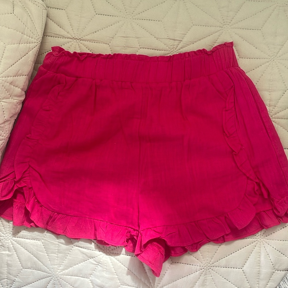 New in pink shorts with pockets! Rarely worn!